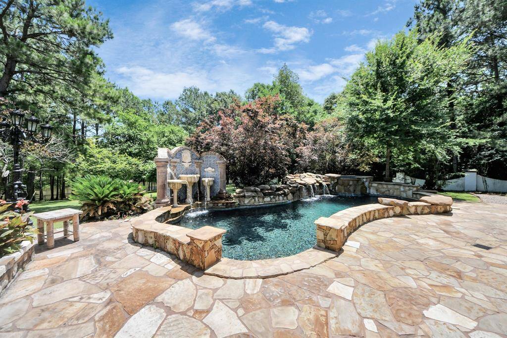 Discover a stunning custom pool with elegant stonework, perfect for relaxation and entertaining.