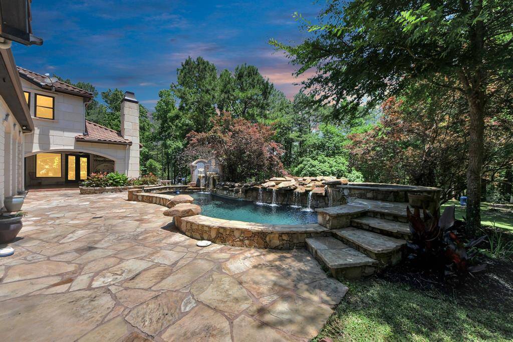 Discover a stunning custom pool with elegant stonework, perfect for relaxation and entertaining.