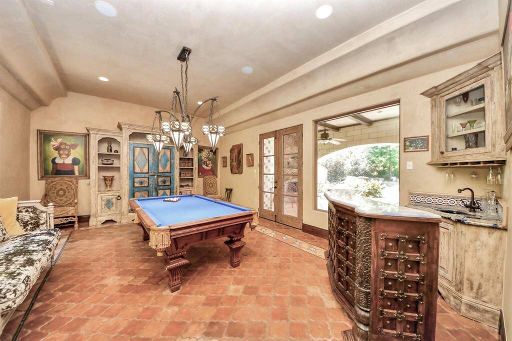 Versatile game room conveniently located next to the mudroom.