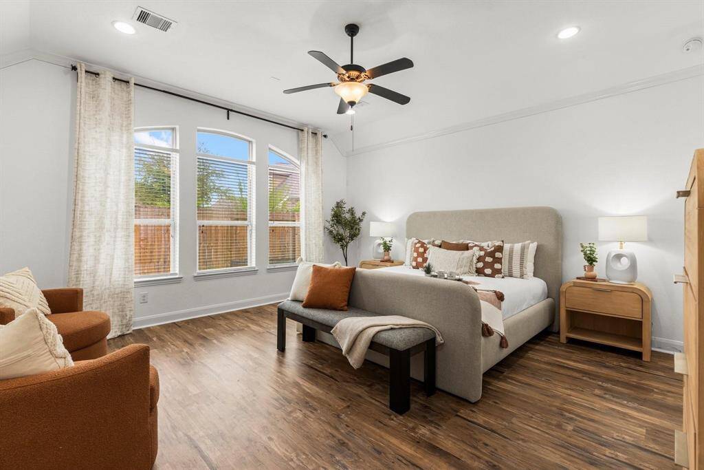 Primary suite looks out over the large backyard