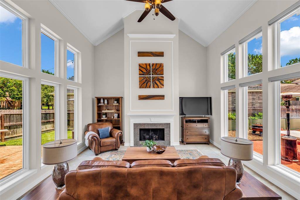 Vaulted Ceiling Family Room with large windows and electric Shades (2024)