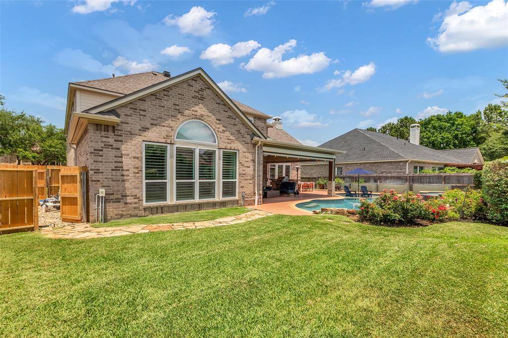 Oversized backyard with gate to pool equipment