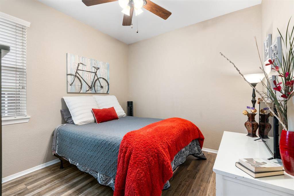 guest bedroom, vinyl plank wood flooring