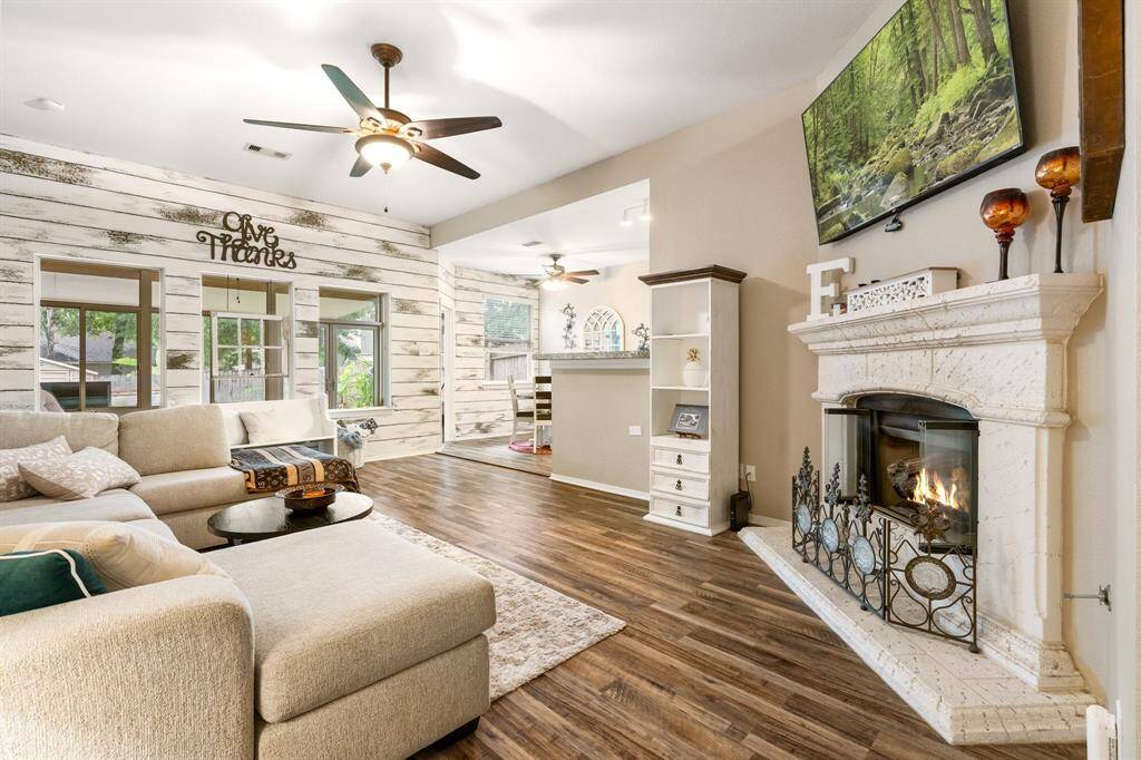 cottage style charm living space, custom painted walls, vinyl wood flooring, gas fireplace