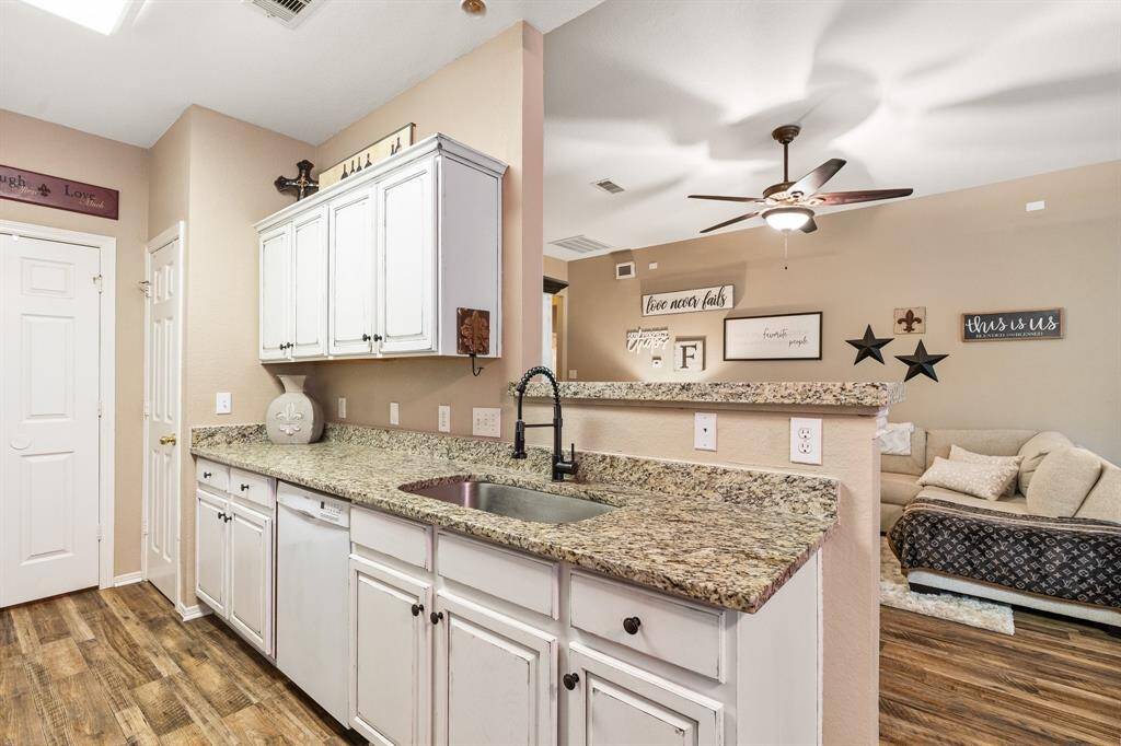 kitchen has granite coutner tops that were added in 2023 along with a deep sink & arched faucet