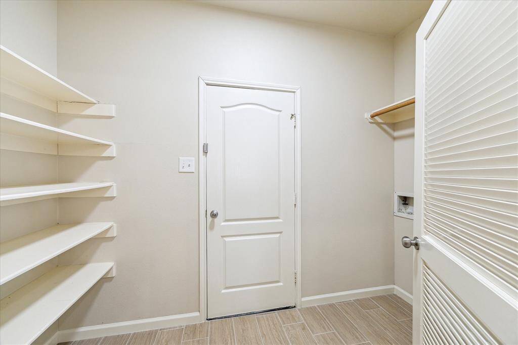 Large pantry and laundry room right off the kitchen space