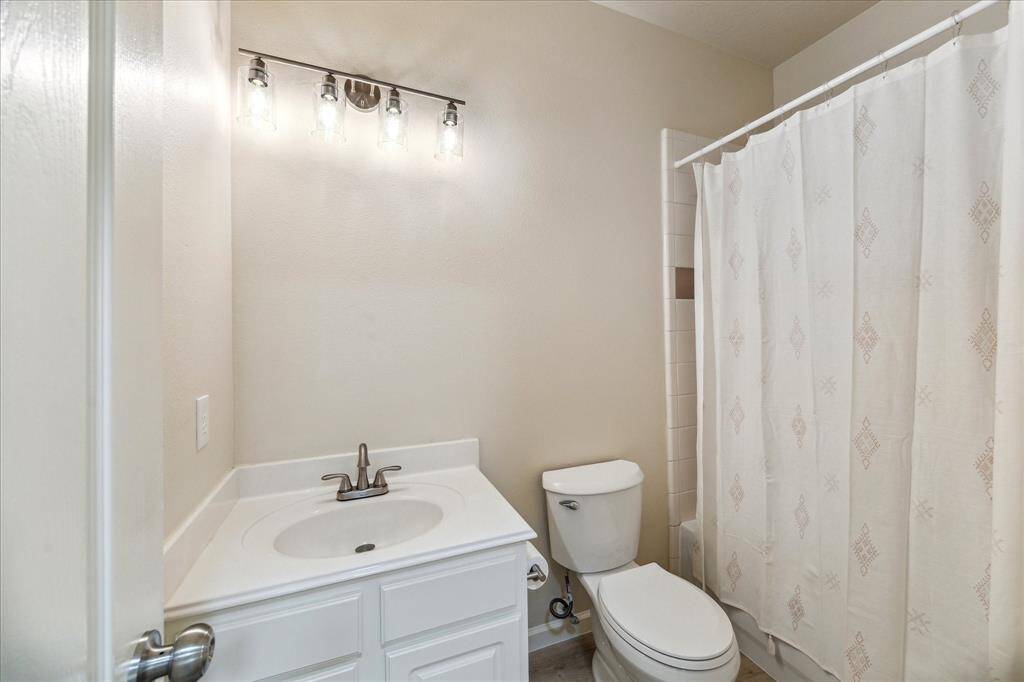 Hall bath upstairs with new fixtures. New mirror has been installed