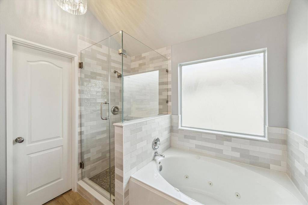 Brand new tile shower, glass surround and jetted tub