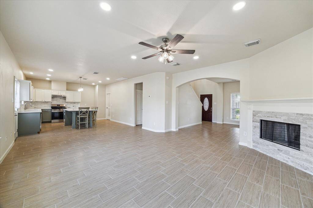 Opens into the modern kitchen