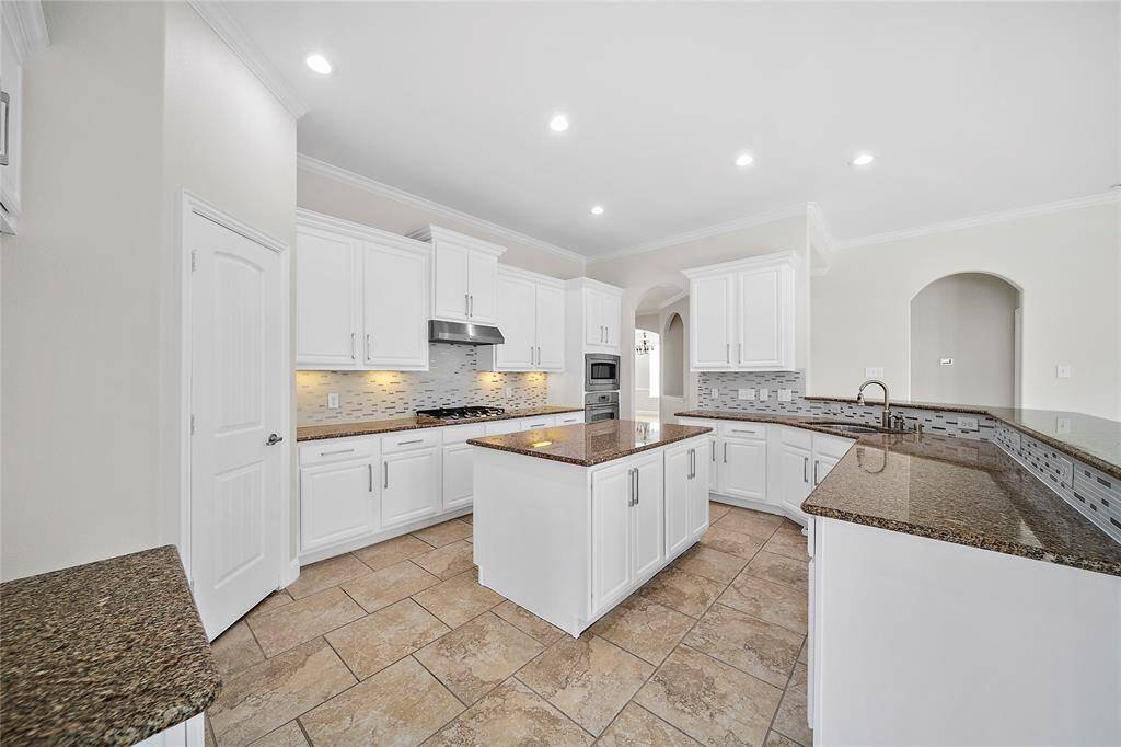 Gorgeous updated kitchen with upgraded backsplash as well as contemporary kitchen cabinets
