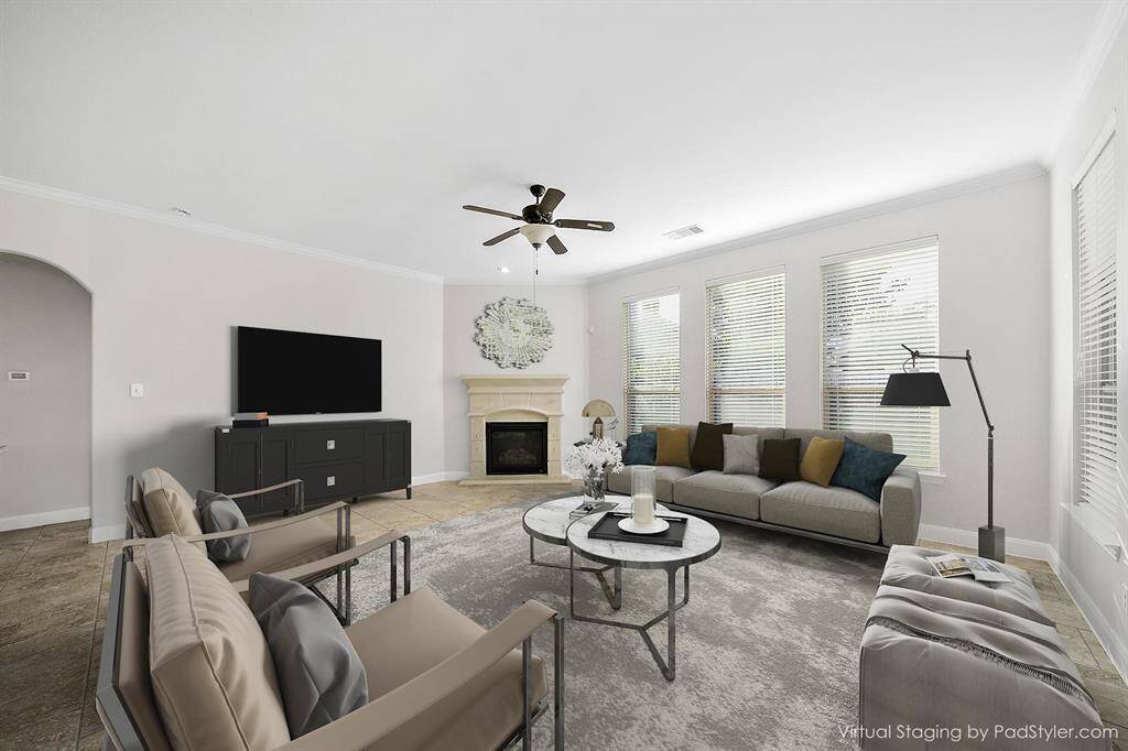 Family room with large picture windows that is perfect for family night games and friend gatherings.