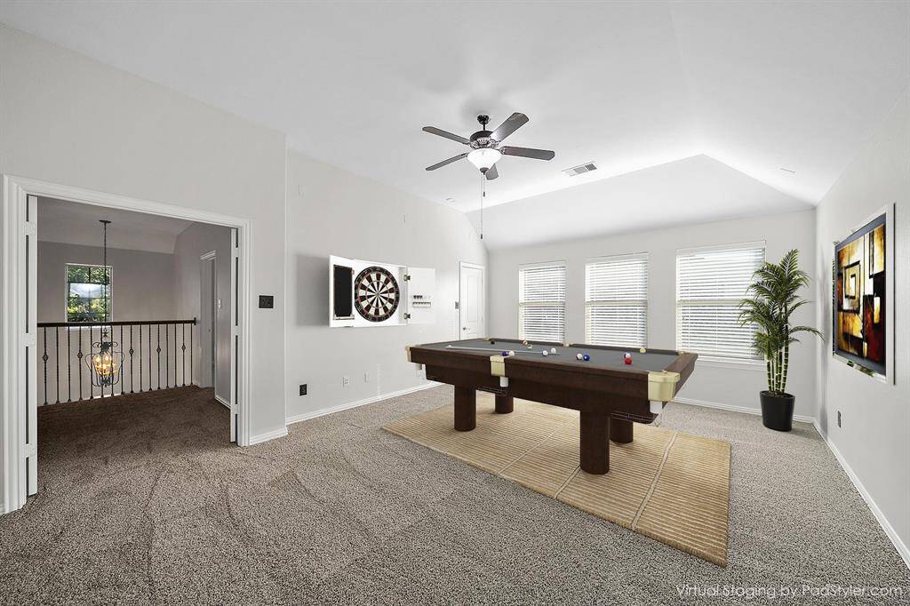 Gameroom with plenty of natural light can be used as a game room and media combo.