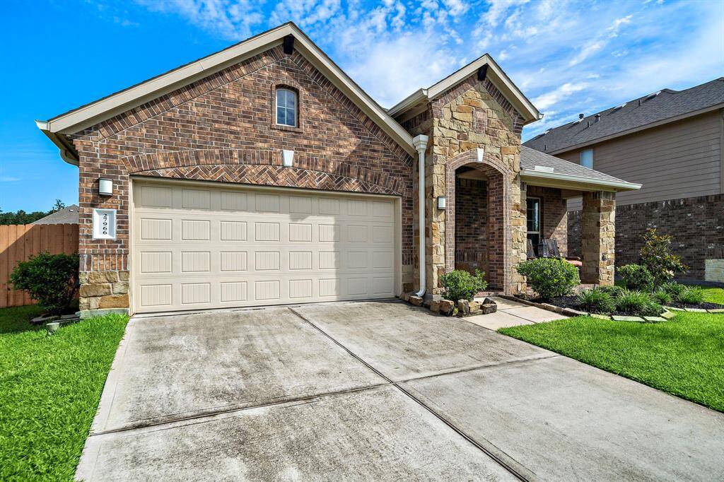 This charming home features a double-wide driveway providing ample parking space, easily accommodating multiple vehicles. The 2-car garage offers additional storage and parking options. A well-maintained walk-up entry leads to the front door, adding curb appeal and a welcoming feel. The exterior is complemented by neat landscaping, creating a pleasant first impression.