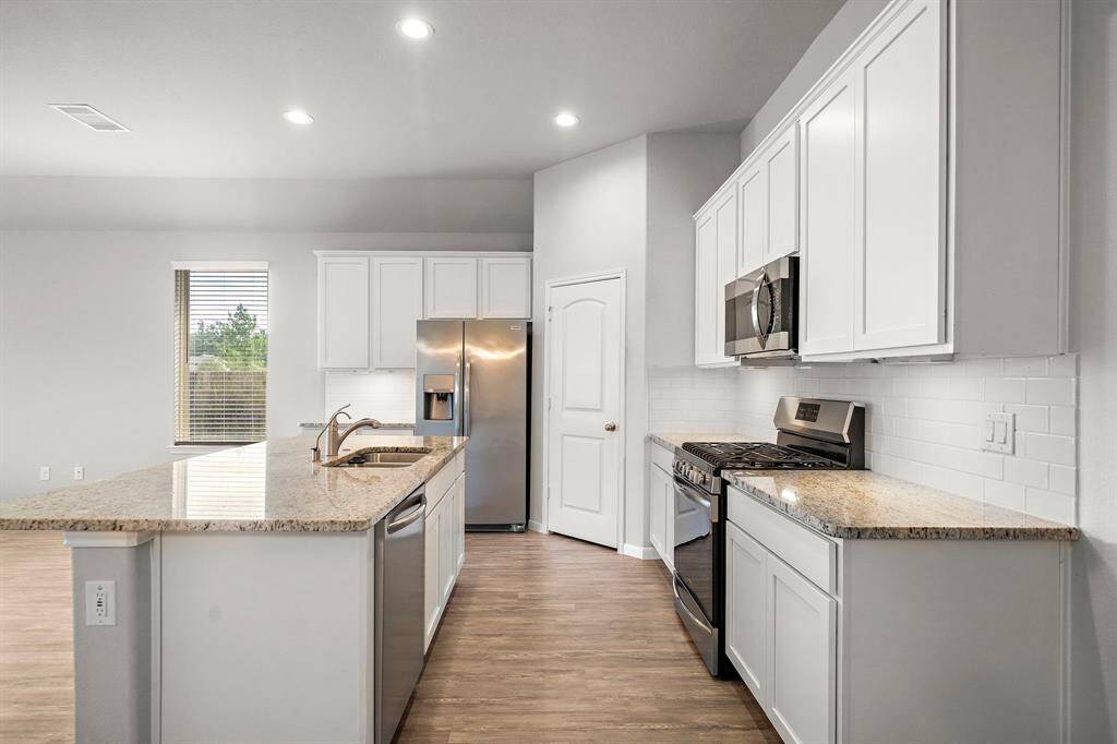 Plenty of storage and counter space, boasting a large pantry and gently used appliances