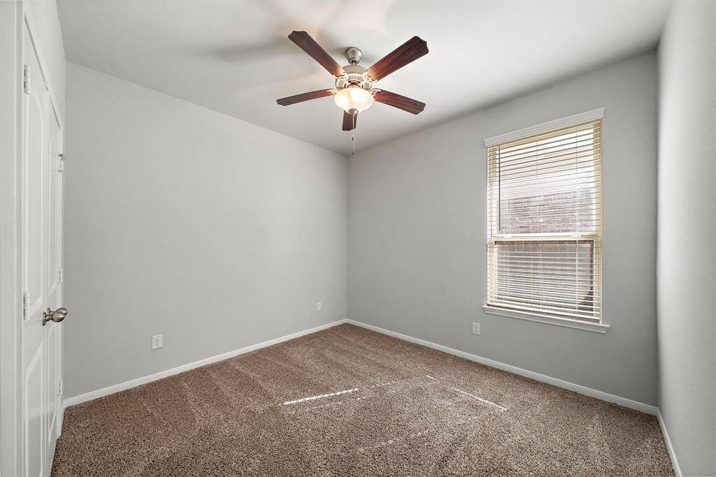 Bedroom Two, located directly across from Bedroom One, offers plenty of space to create your ideal retreat. Its layout ensures comfort and privacy while maintaining a connection to the rest of the home.