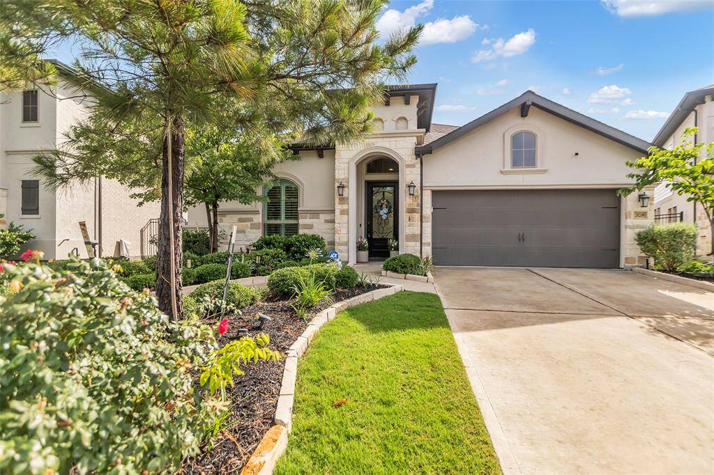 The property’s curb appeal is unparalleled with thoughtfully integrated stone accents that lend a timeless and sophisticated charm to the exterior.  The façade creates a sense of stability and elegance, perfectly complementing the lush greenery surrounding the home. Every detail contributes to an inviting and polished aesthetic, making the first impression truly unforgettable.