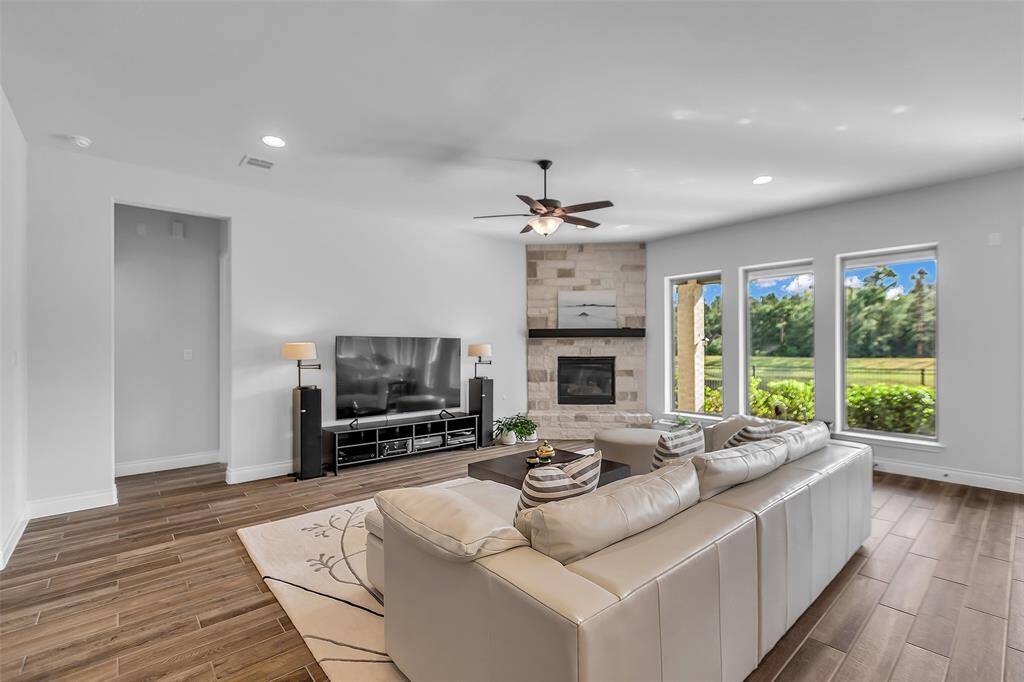 This open-concept design seamlessly connects the family room to the adjacent kitchen, making it an ideal hub for entertaining or simply relaxing with family and friends.