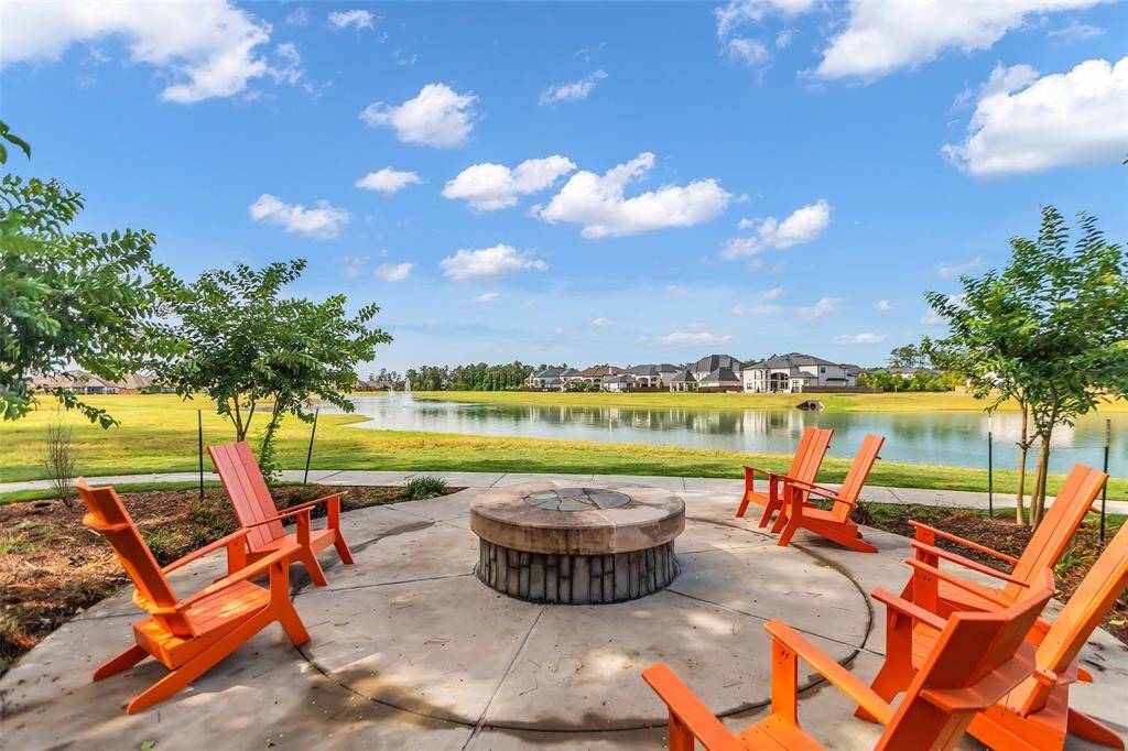 A covered patio, complete with durable epoxy flooring, adds a touch of polished sophistication, making it the perfect spot for outdoor relaxation or entertaining. This seamless blend of natural beauty and refined finishes creates a retreat for those seeking harmony and privacy in their outdoor living space.