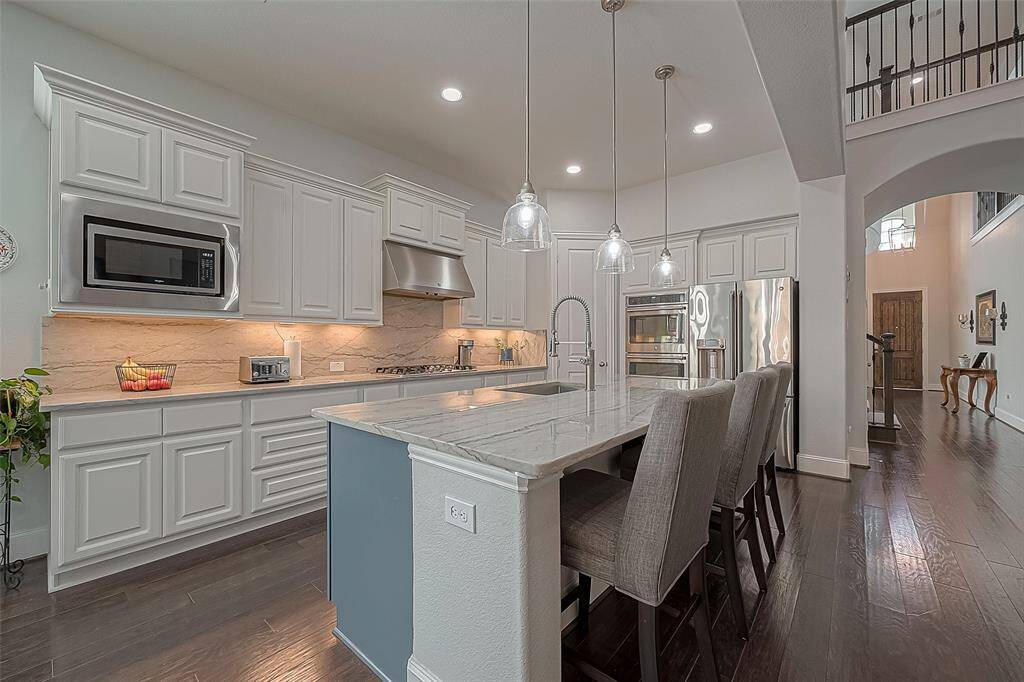 All lower kitchen cabinets have full extension pull out drawers for easy access to items.  Island also includes built in pull-out trash can.