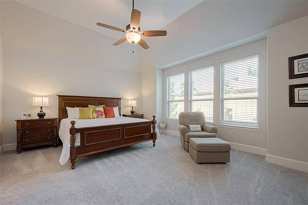 Grand downstairs master bedroom with lots of natural lighting.  Option to leave all furniture pictured (including large dresser not pictured adjacent to bed).  Mattress not included.