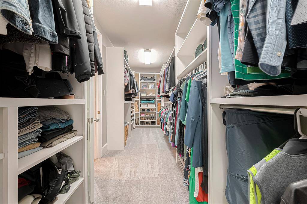 Incredibly large master closet with custom built-ins throughout.