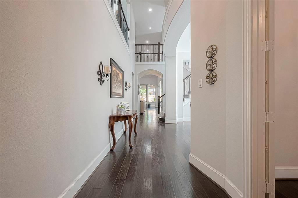 Grand entrance with large office to the right with private French doors.