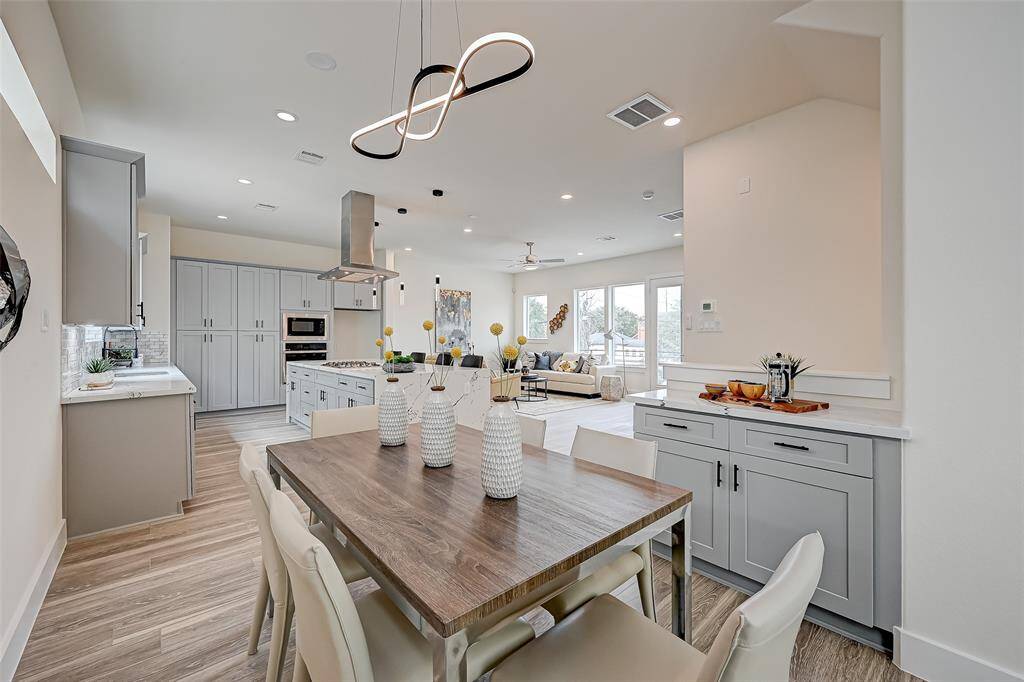 Open concept with tons of natural lighting.(Previously staged.)