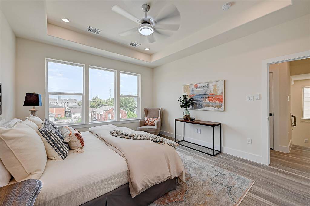 Primary suite with beautiful tray ceilings. (Previously staged.)