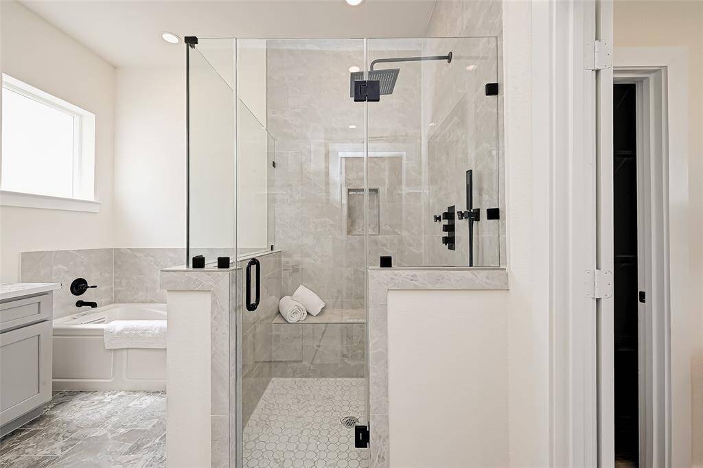 Primary separate shower comes with 4 body jets and jacuzzi bathtub. (Previously staged.)