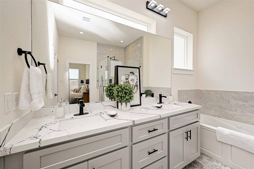 Primary double sink vanity. (Previously staged.)
