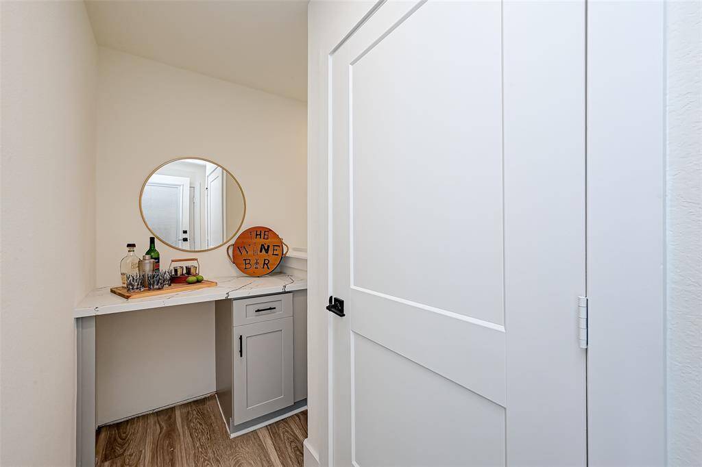 4th floor: Wine bar area and storage closet space or future elevator. (Previously staged.)
