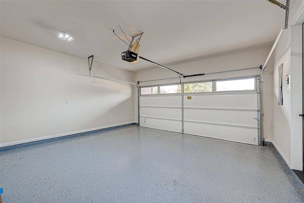 2 car garage with epoxy flooring plus EV charger.