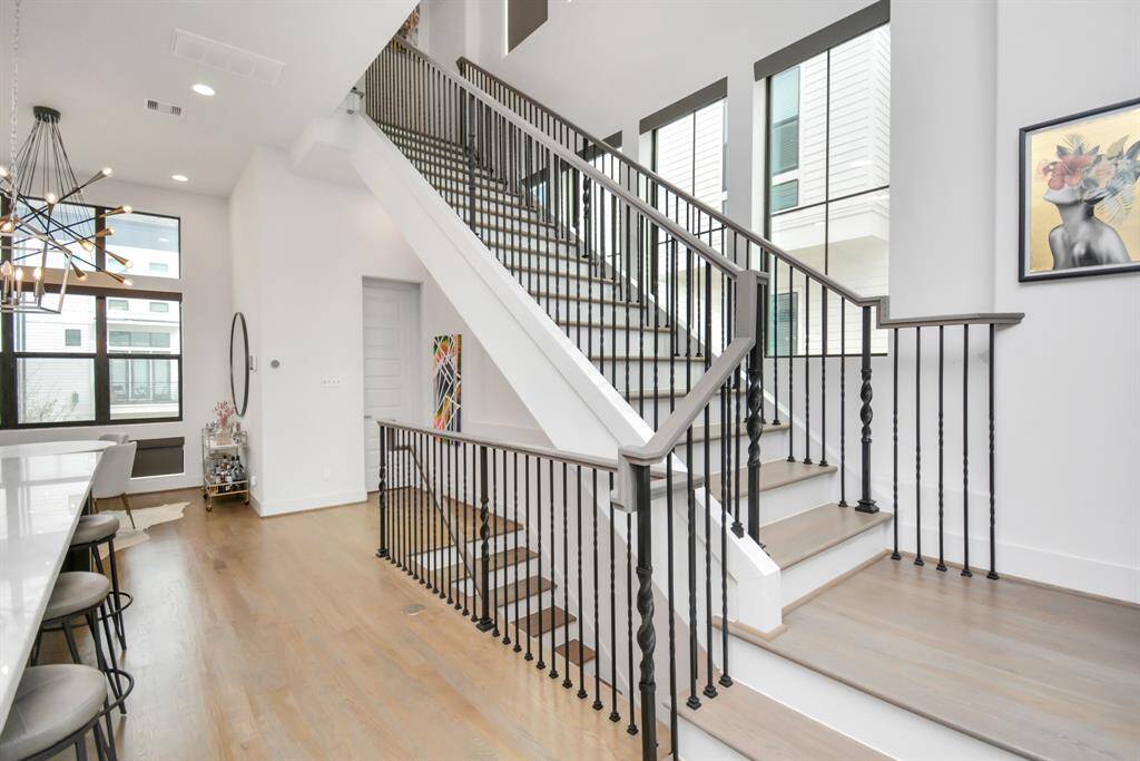 Illuminate your home with a stunning window-lined staircase, bathing the second floor in natural light.