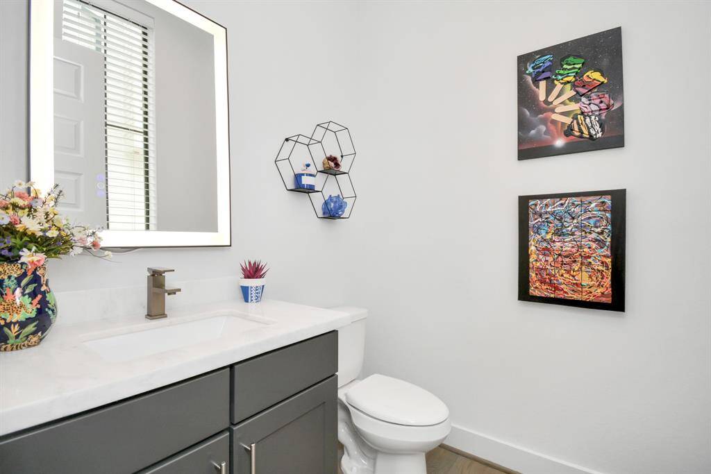 Stylish second-floor half bath for added convenience.