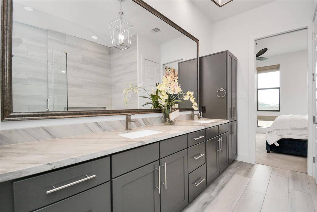 Spacious primary bathroom with ample counter space for all your essentials.