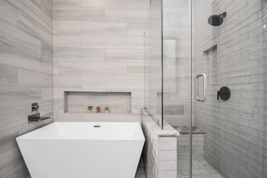 Luxurious soaking tub in the primary bathroom, perfect for unwinding.