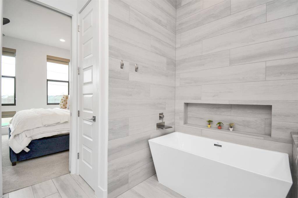 Indulge in the ultimate relaxation with this luxurious soaking tub in the primary bathroom.