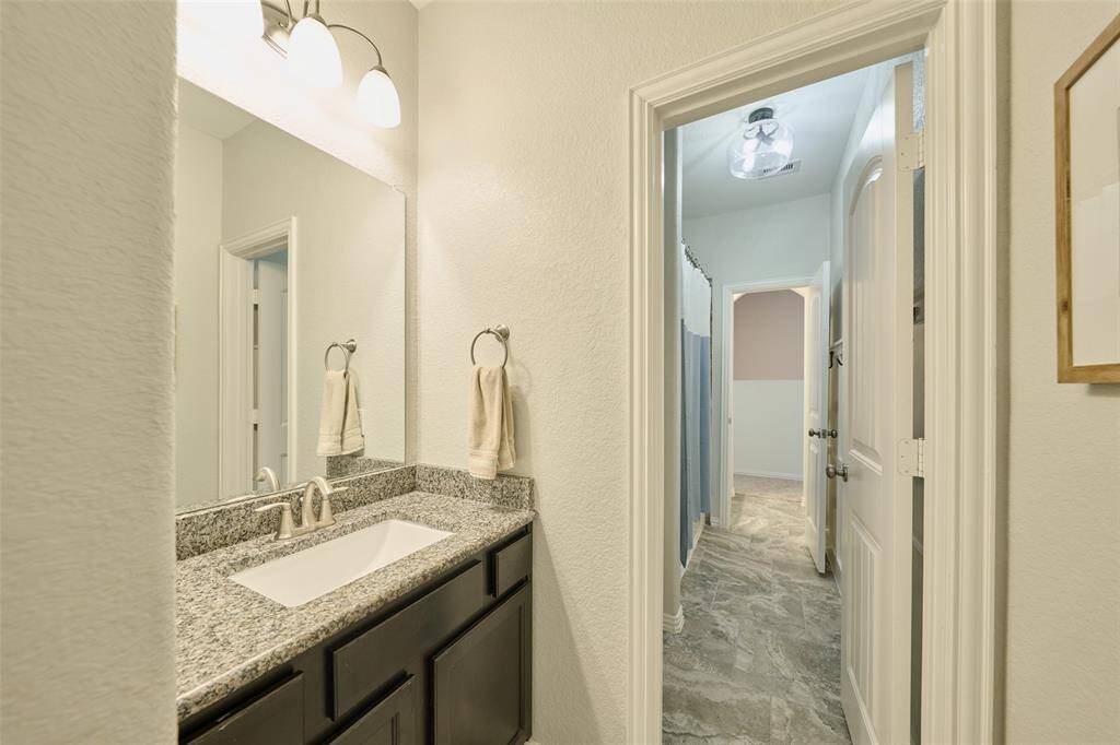 This is a Jack and Jill bath.  This vanity accesses through the hall.  Notice the board and batten detail.