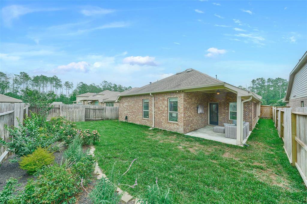 The back yard is beautifully landscaped.