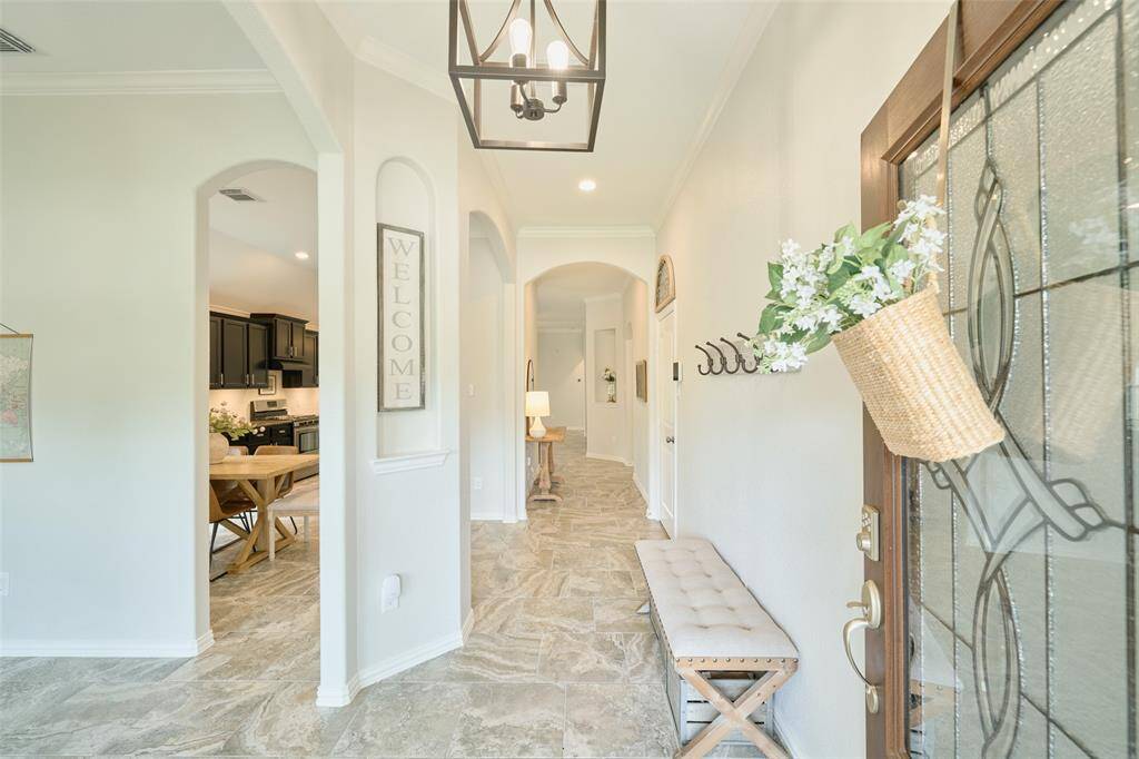 Upon entering you step into a lovely transitional foyer.
