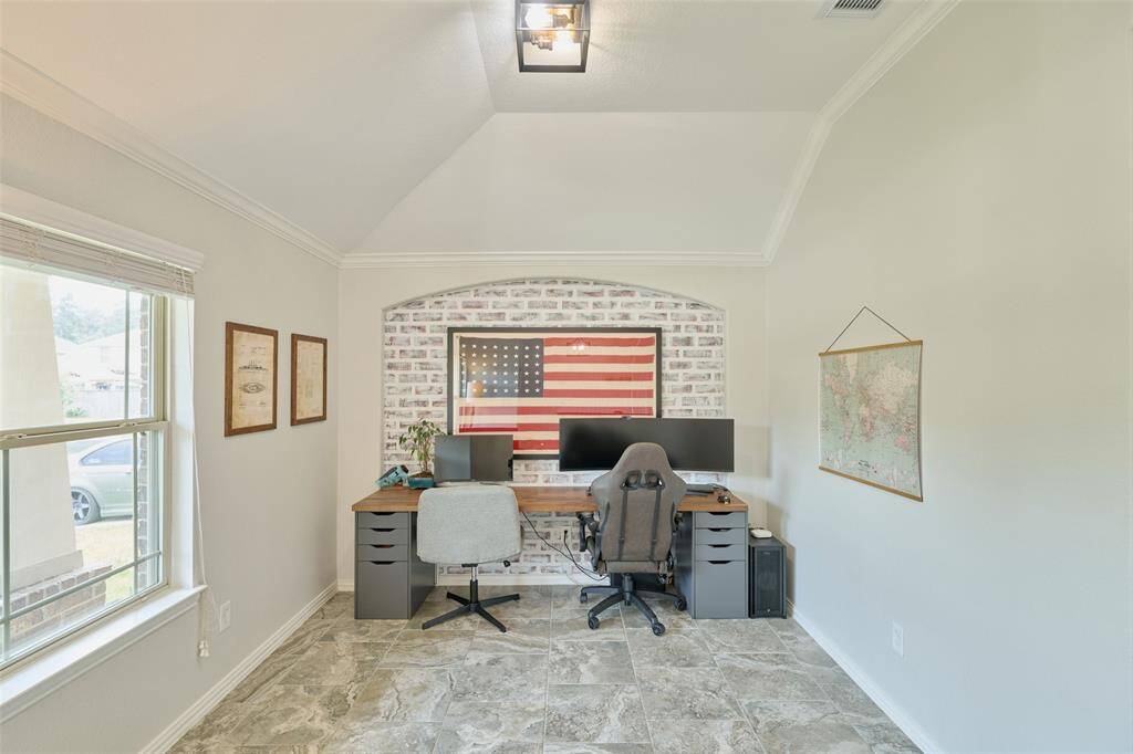 The current owners are using this formal dining space as a home office.