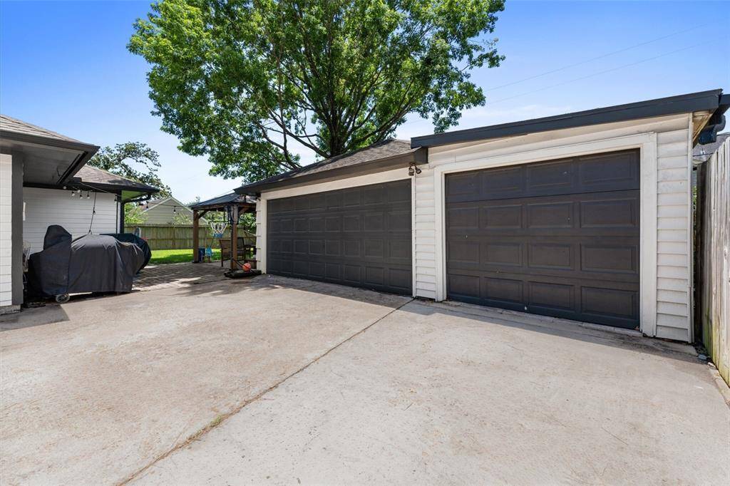 Two car garage with third bay for storage.