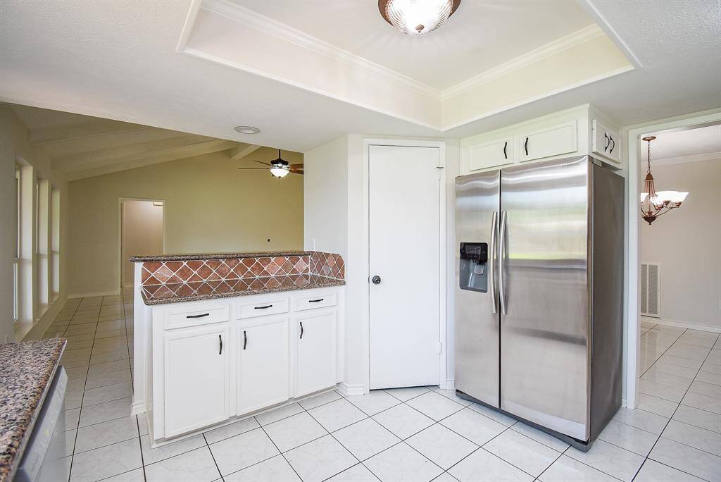 Kitchen open to family/living room. Walk in pantry next to refrigerator