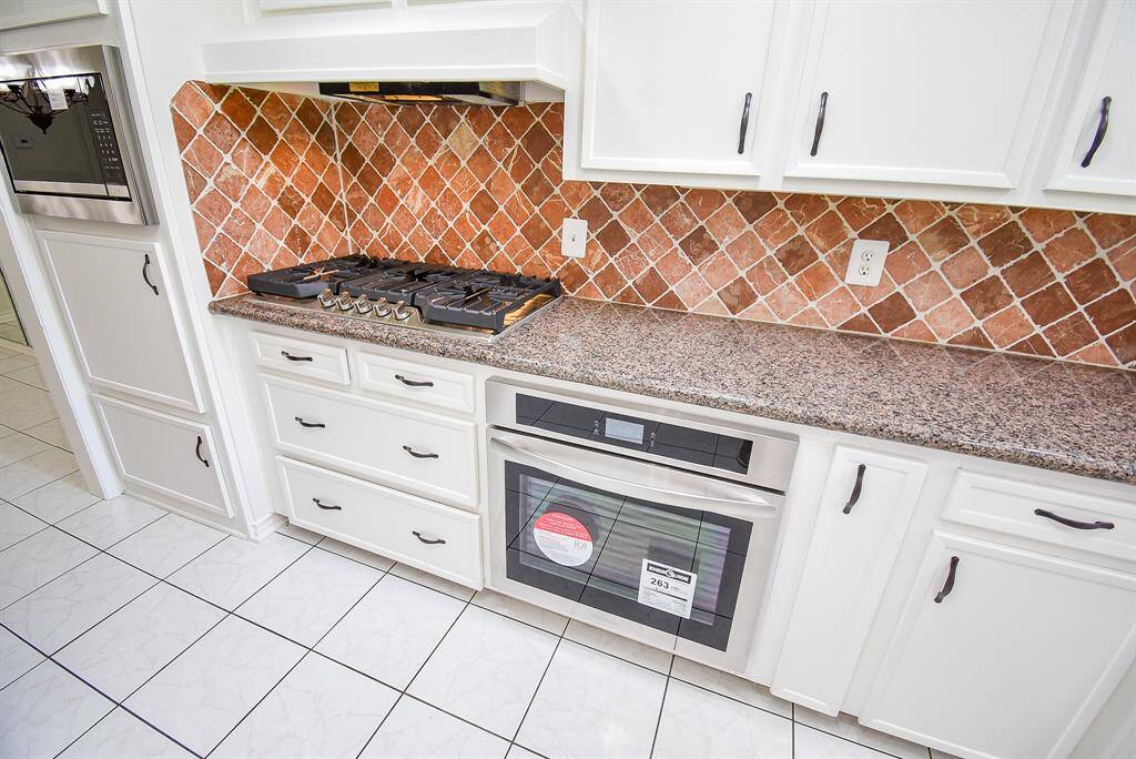 Close up of new oven, microwave and Gas cooktop.   You will be the first one to use them!
