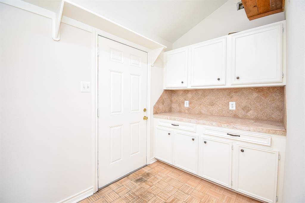 Storage area in game room leads to side yard.  I'm thinking a small refrigerator and ice maker in here!