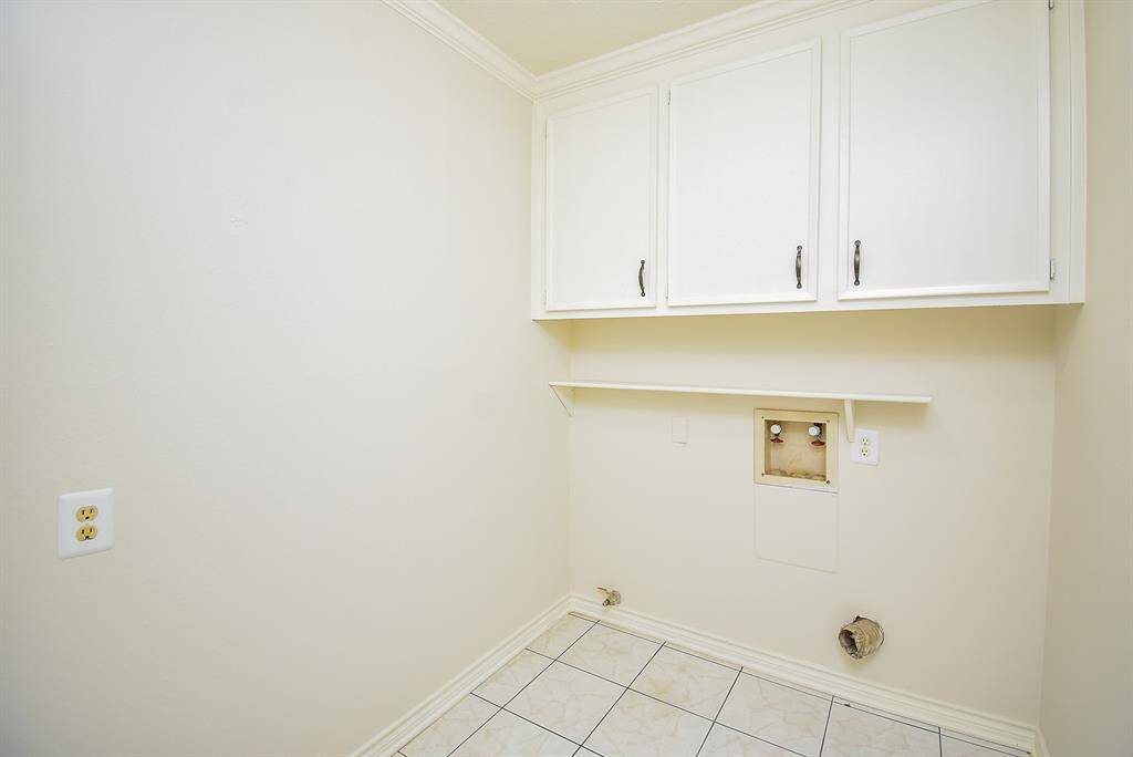 Laundry room is adjacent to attached garage, so it makes a great mud room too.  Notice gas or electric dryer hook up