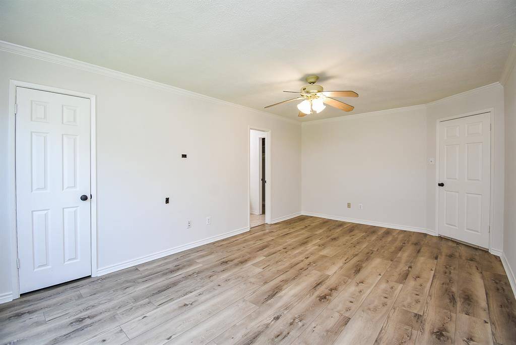 Primary bedroom  with 1 of 2 closets on left of photo.