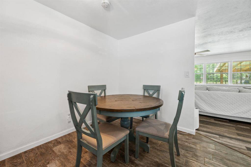 Dining area nestled in the corner with plenty of room for a larger table.
