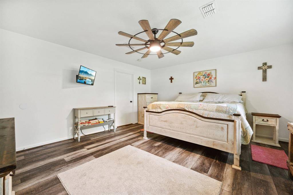 Primary bedroom is spacious and updated.