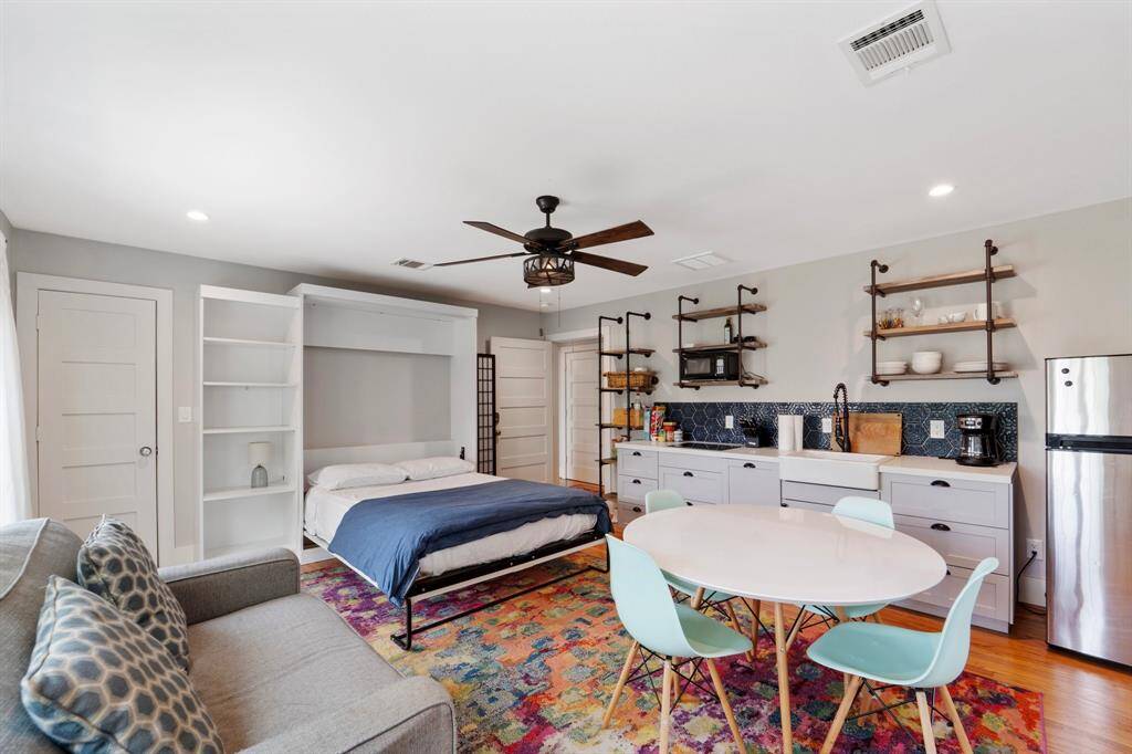 It also offers a built-in Murphy bed, maximizing space and offering versatile living accommodations.